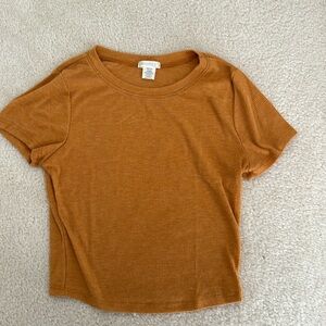 Women’s rust orange tee in size medium.